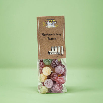 Frontalansicht von Früchtemischung Bonbons in einer transparenten Plastiktüte mit einem Pappetikett.