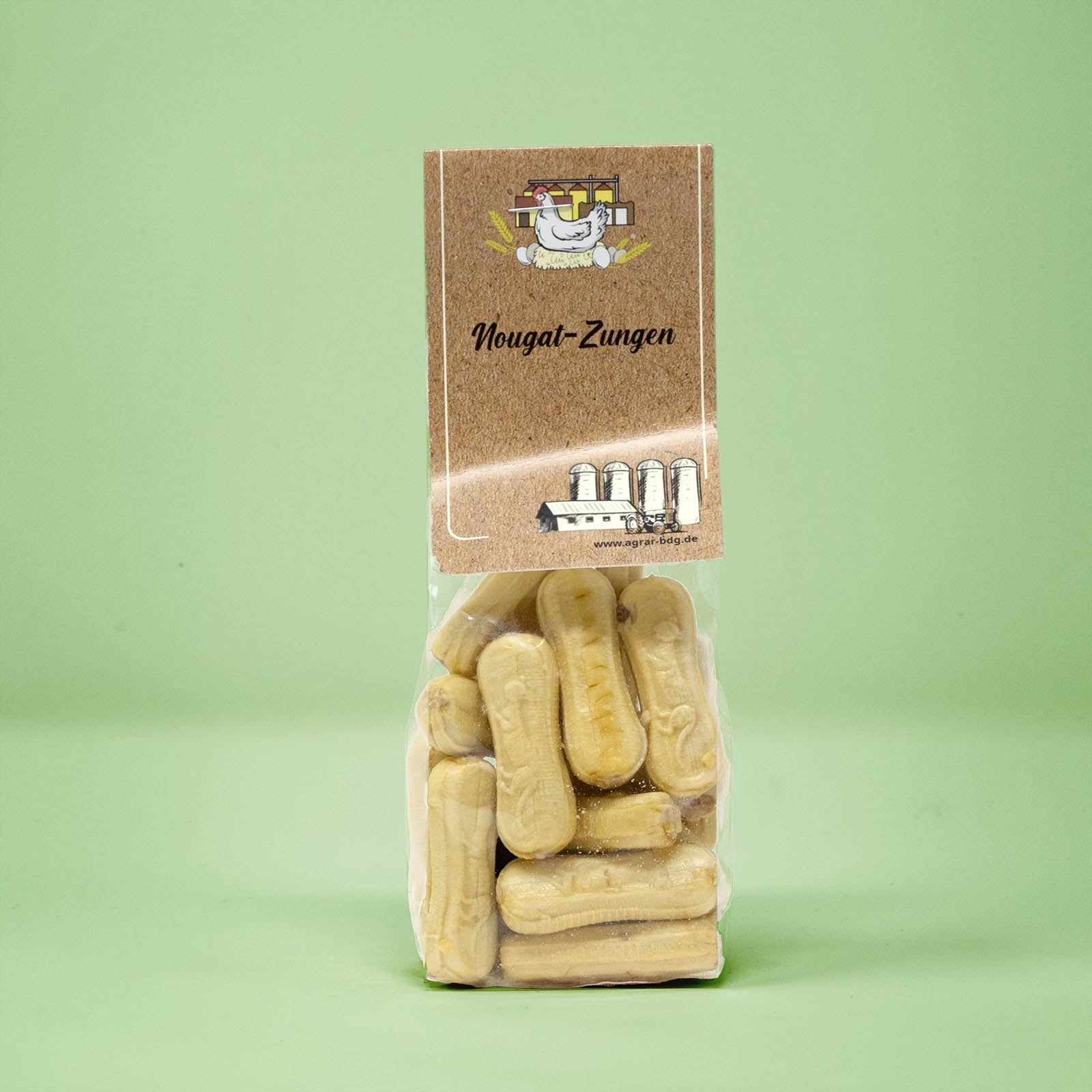 Frontalansicht von Nougat Zungen in einer transparenten Plastiktüte mit einem Pappetikett.