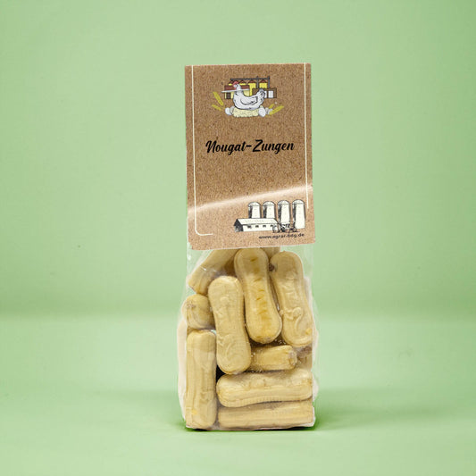 Frontalansicht von Nougat Zungen in einer transparenten Plastiktüte mit einem Pappetikett.