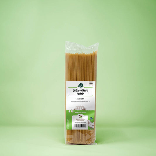 Frontalansicht von Dinkelvollkorn Nudeln Spaghetti 500 Gramm in einer Plastiktüte mit Etikett.