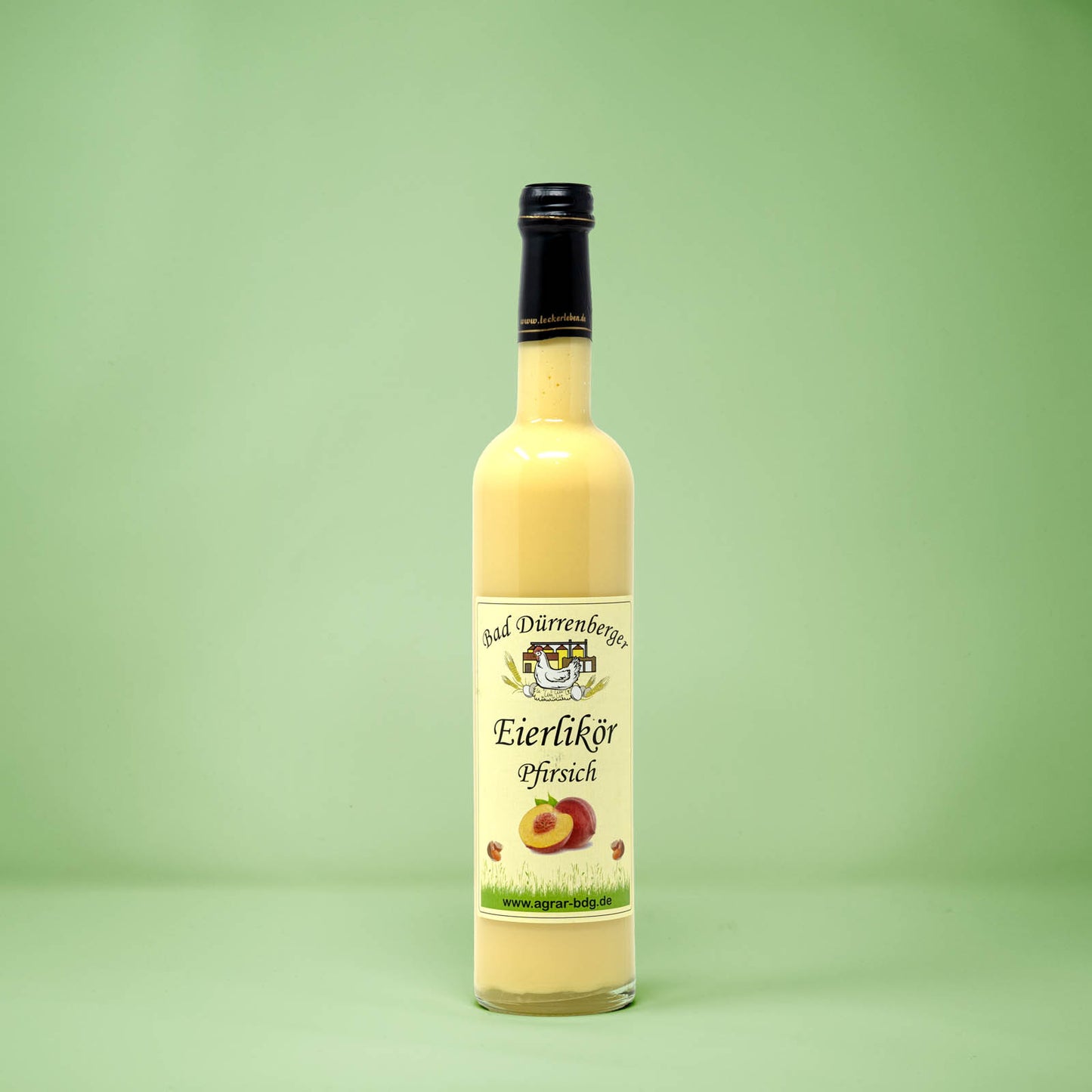 Frontalansicht von Bad Duerrenberger Eierlikoer Pfirsich 500 Milliliter in einer Glasflasche mit Etikett.