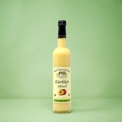 Frontalansicht von Bad Duerrenberger Eierlikoer Pfirsich 500 Milliliter in einer Glasflasche mit Etikett.