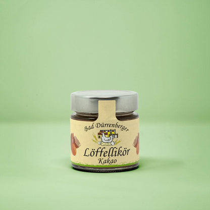 Frontalansicht von Bad Duerrenberger Loeffellikoer Kakao 200 Milliliter in einem Glas mit Etikett.